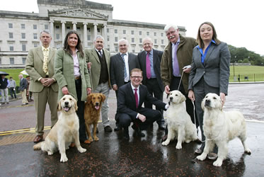 Golden Retriever owners with sponsors at Stormont